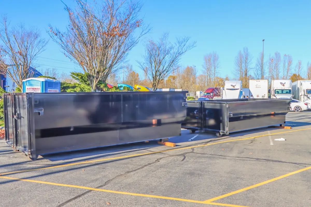 Professional dumpster rental service with roll-off container on residential driveway in Irving